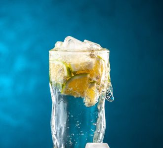 front-view-glass-soda-with-lemon-slices-ice-cubes-blue-photo-champagne-water-cocktail-lemonade